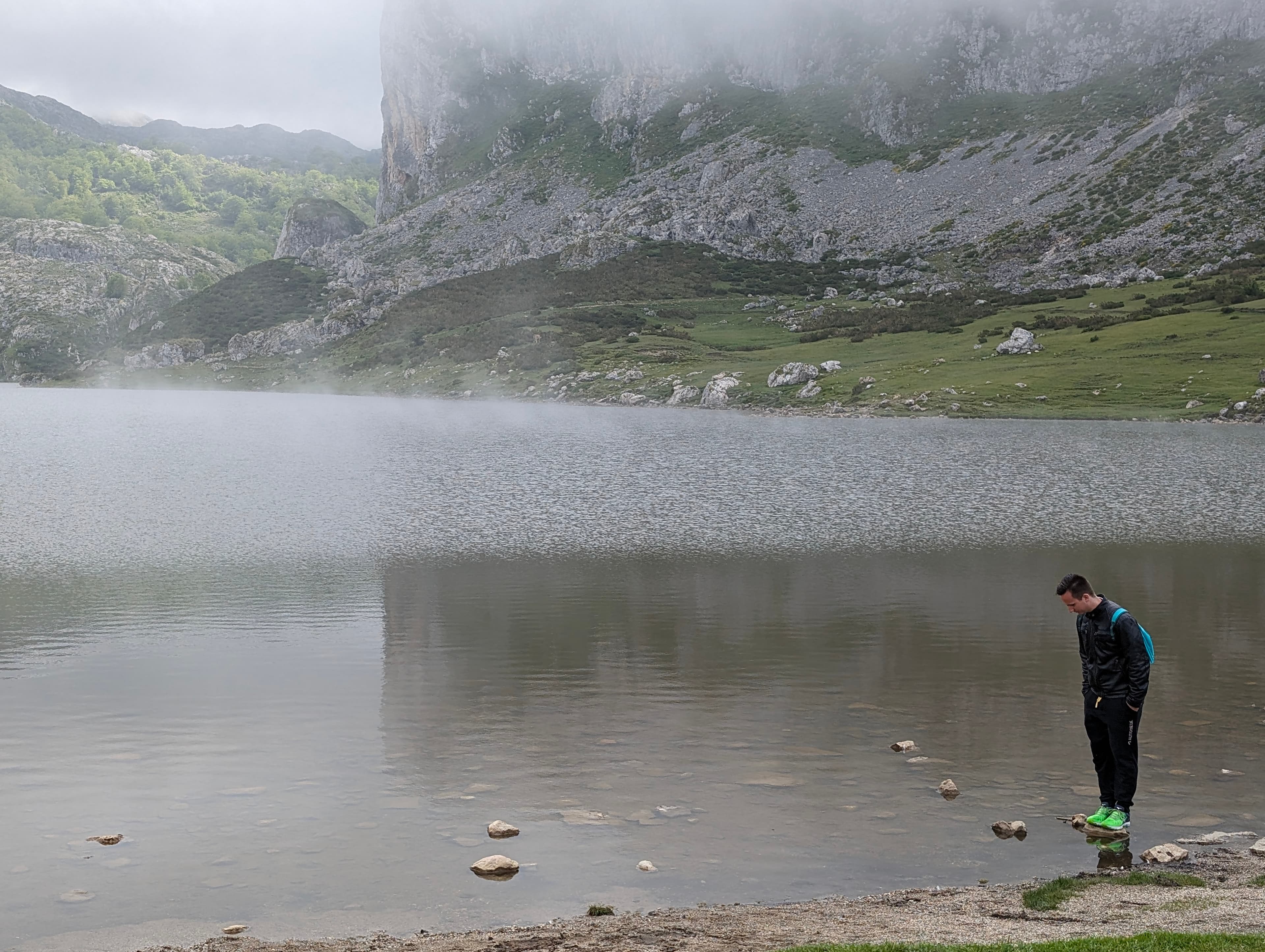 Luka Kralj standing by a lake